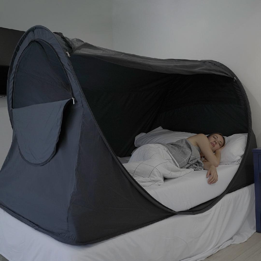 Cost-effective Privacy Bed Tent with a woman inside